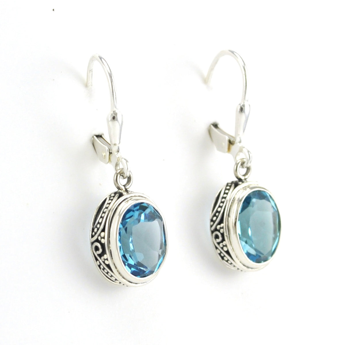 Side View Sterling Silver Blue Topaz 8x10mm Oval Bali Dangle Earrings