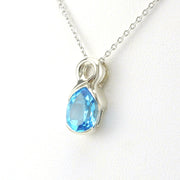 Side View Sterling Silver Blue Topaz 7x9mm Tear Twist Necklace