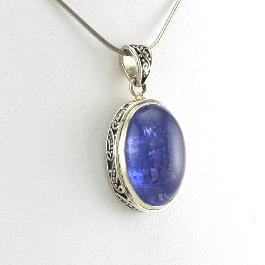 Side View Sterling Silver Tanzanite 12x22mm Cabochon Oval Bali Pendant