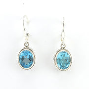 Alt View Sterling Silver Blue Topaz 8x10mm Oval Bali Dangle Earrings