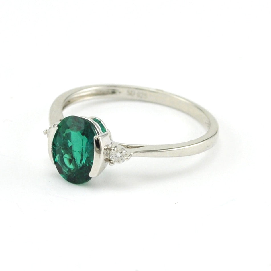 Side View Sterling Silver Created Emerald 1.1ct Oval Diamond .06 Ring