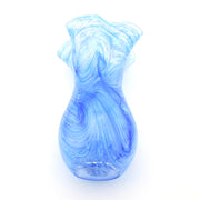 A decorative glass vase with a flared, ruffled rim and a bulbous body, crafted from light blue and white marbled glass, shown against a plain white background.