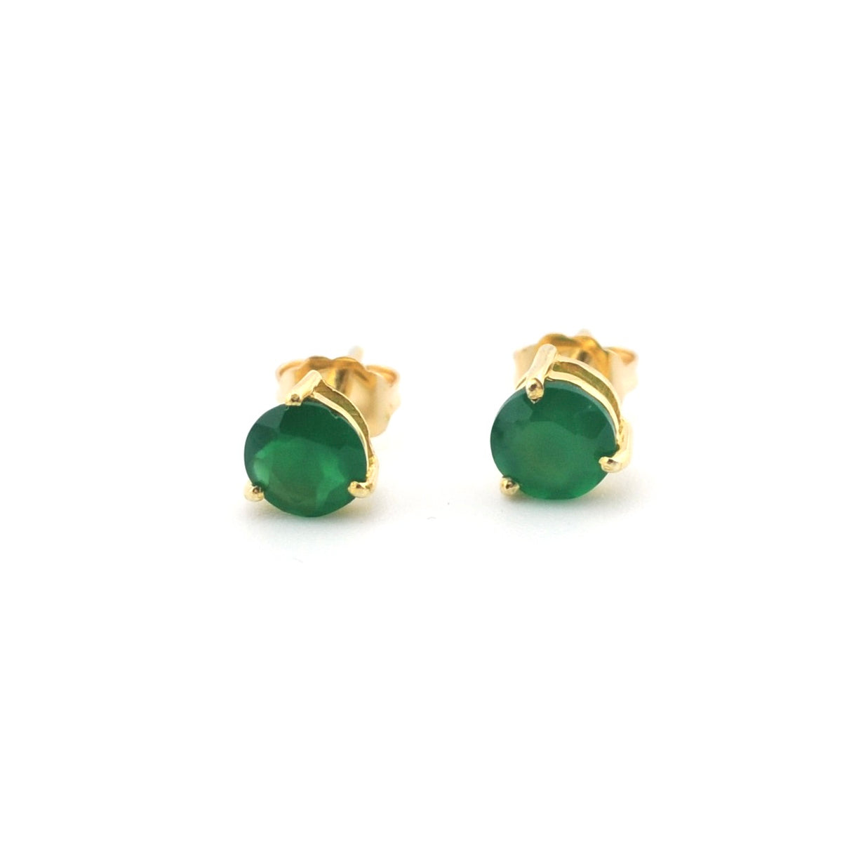 Gold earrings on a white background