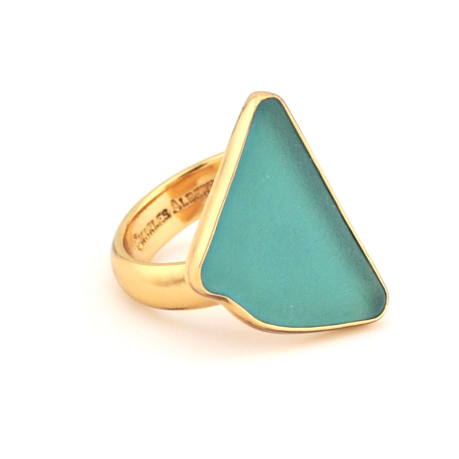 Gold ring with a teal triangle on a white background