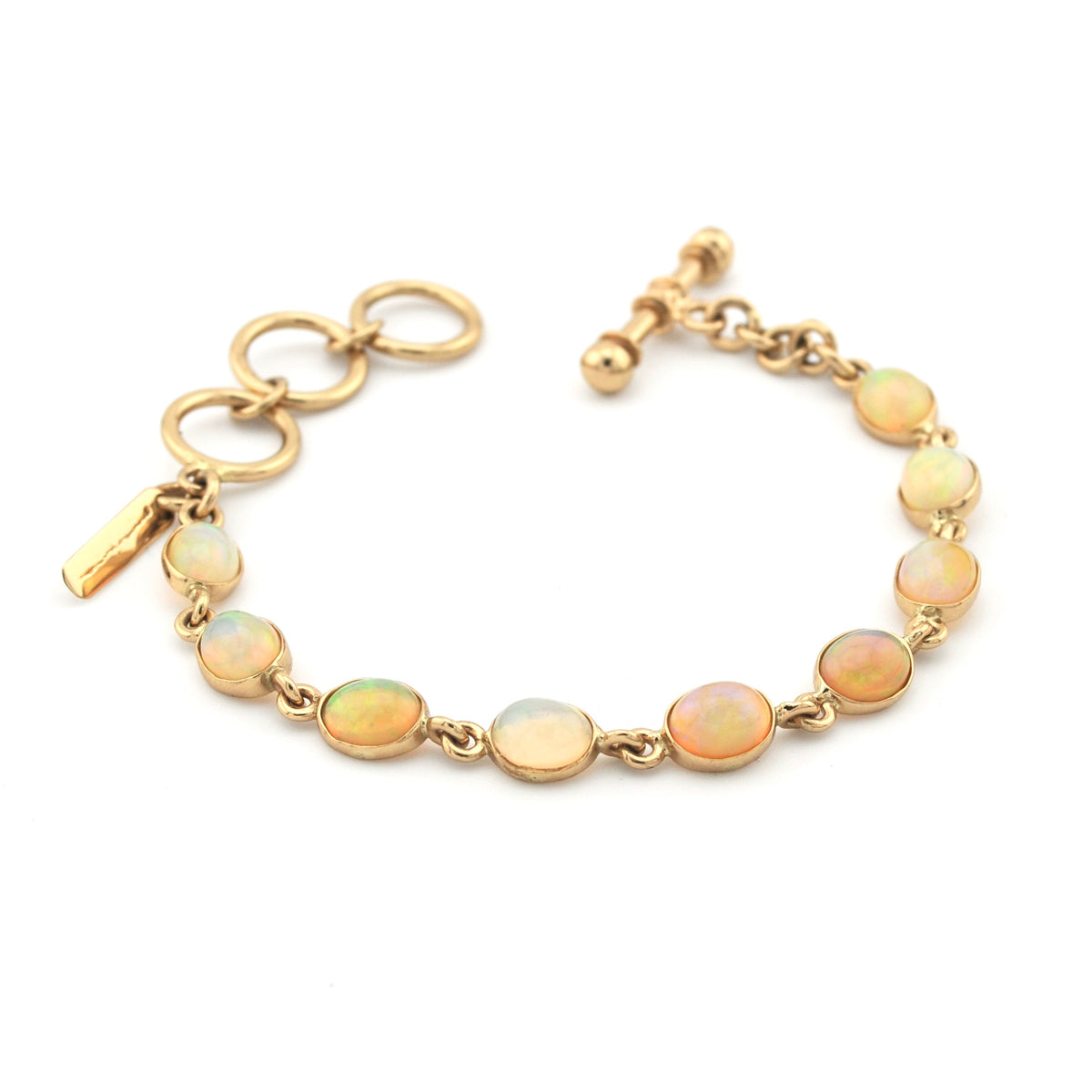 Gold bracelet with opal beads on a white background