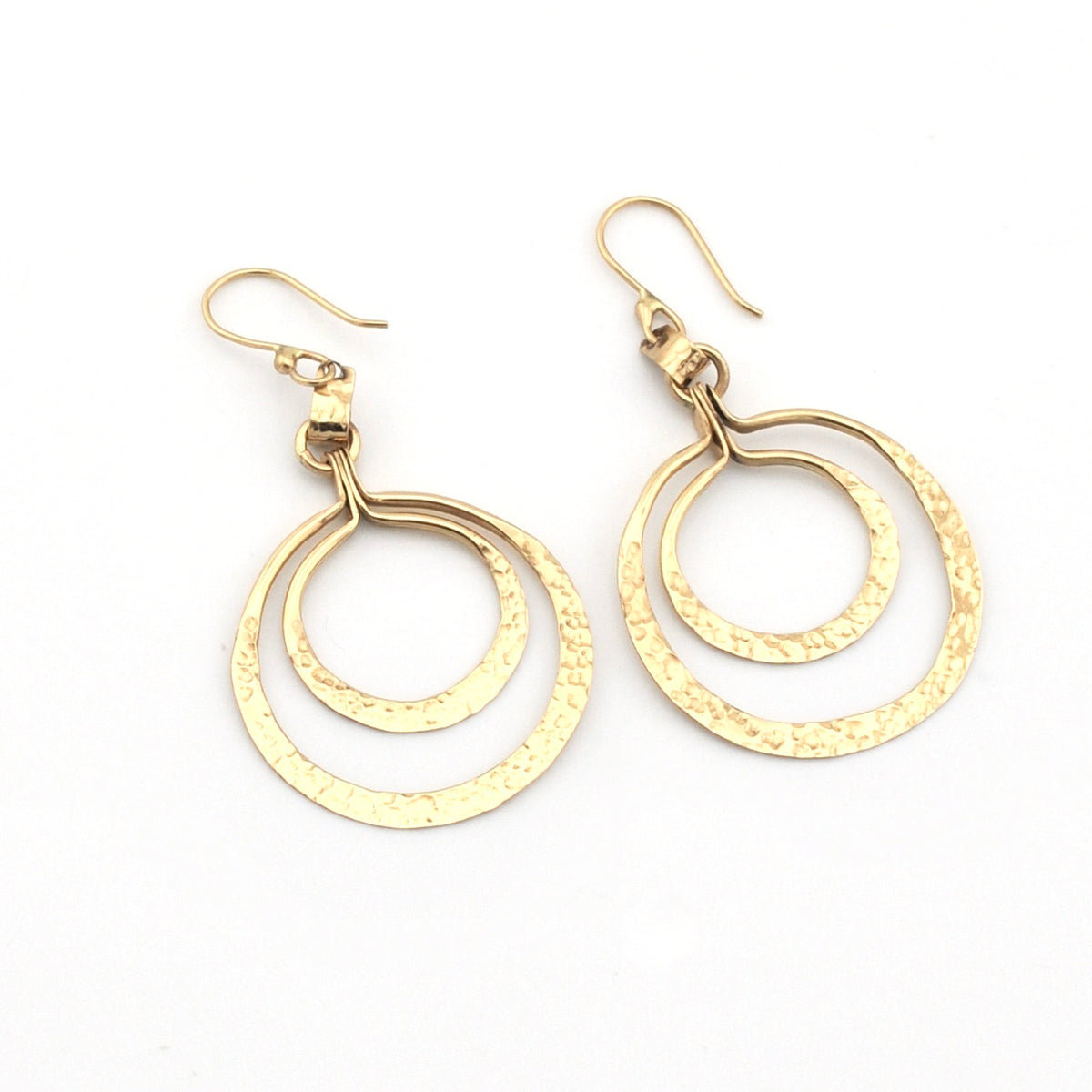 Gold hoop earrings on a white background