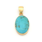 Turquoise pendant with gold frame on a white background