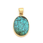 Turquoise pendant with gold frame on a white background