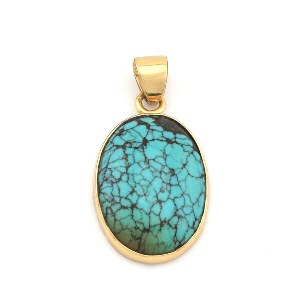 Turquoise pendant with gold frame on a white background