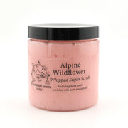 Jar of Alpine Wildflower Whipped Sugar Scrub with black lid on a white background