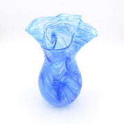 A blue and white marbled glass vase with a flared rim, photographed on a clean white background.