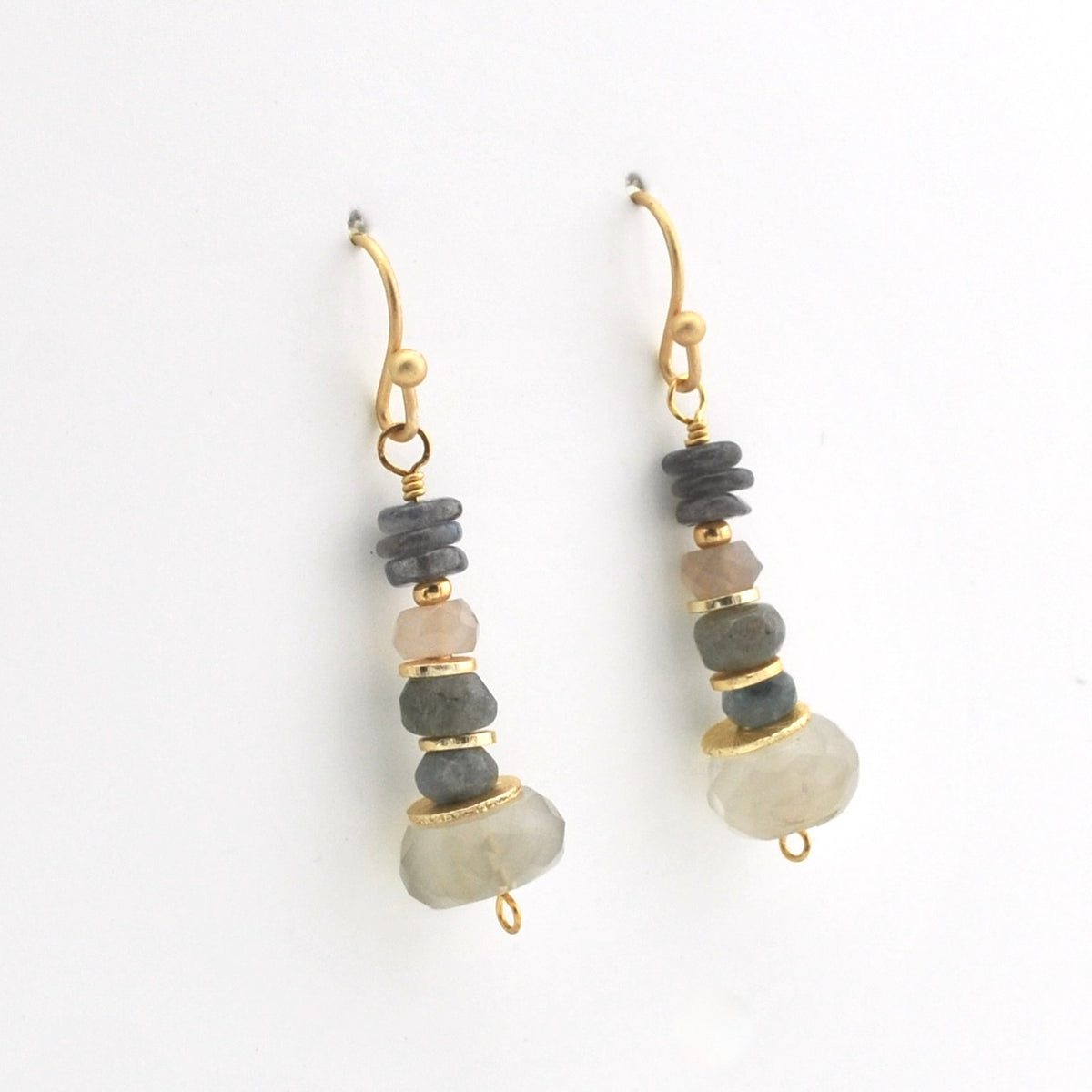 A pair of gold drop earrings featuring natural stone beads in gray, pale pink, and light green, displayed against a clean white background.