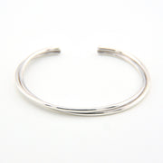 Silver bangle on a white background