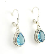 Side View Silver Blue Topaz 8x10mm Tear Bali Dangle Earrings
