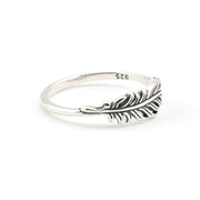 A sterling silver feather ring with a polished band and an intricately detailed feather setting, featuring a '925' hallmark on the inside, shown on a clean white background.