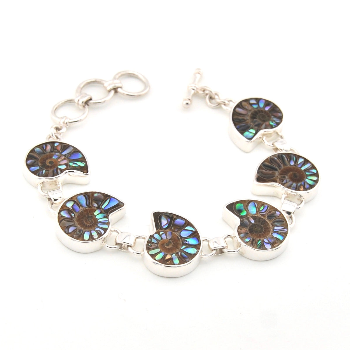 Silver bracelet with circular, multicolored stone components on a white background
