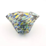 Multicolored glass bowl on a white background