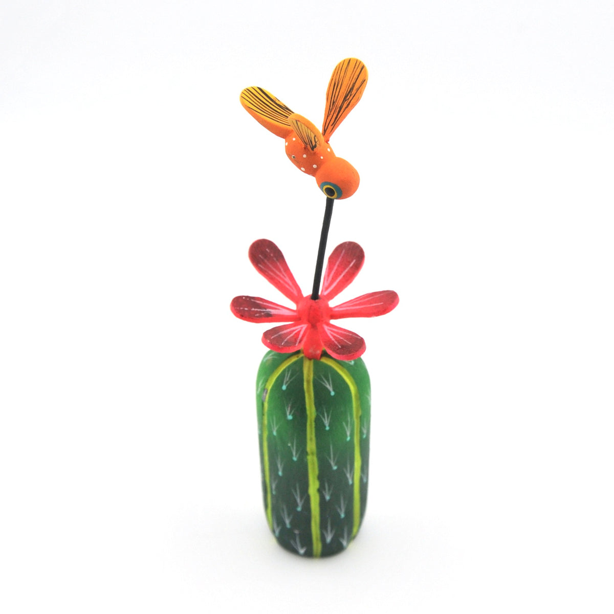 Decorative wood sculpture of a hummingbird on a red flower with a green base on a white background