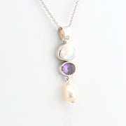 Necklace with three stones on a white background