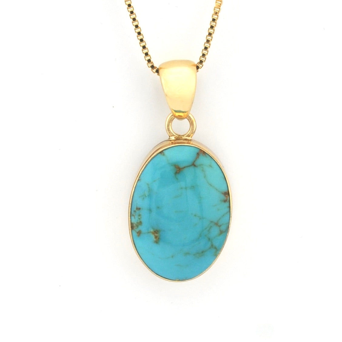 Turquoise pendant necklace on a gold chain against a white background
