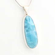 Blue pendant on a white background