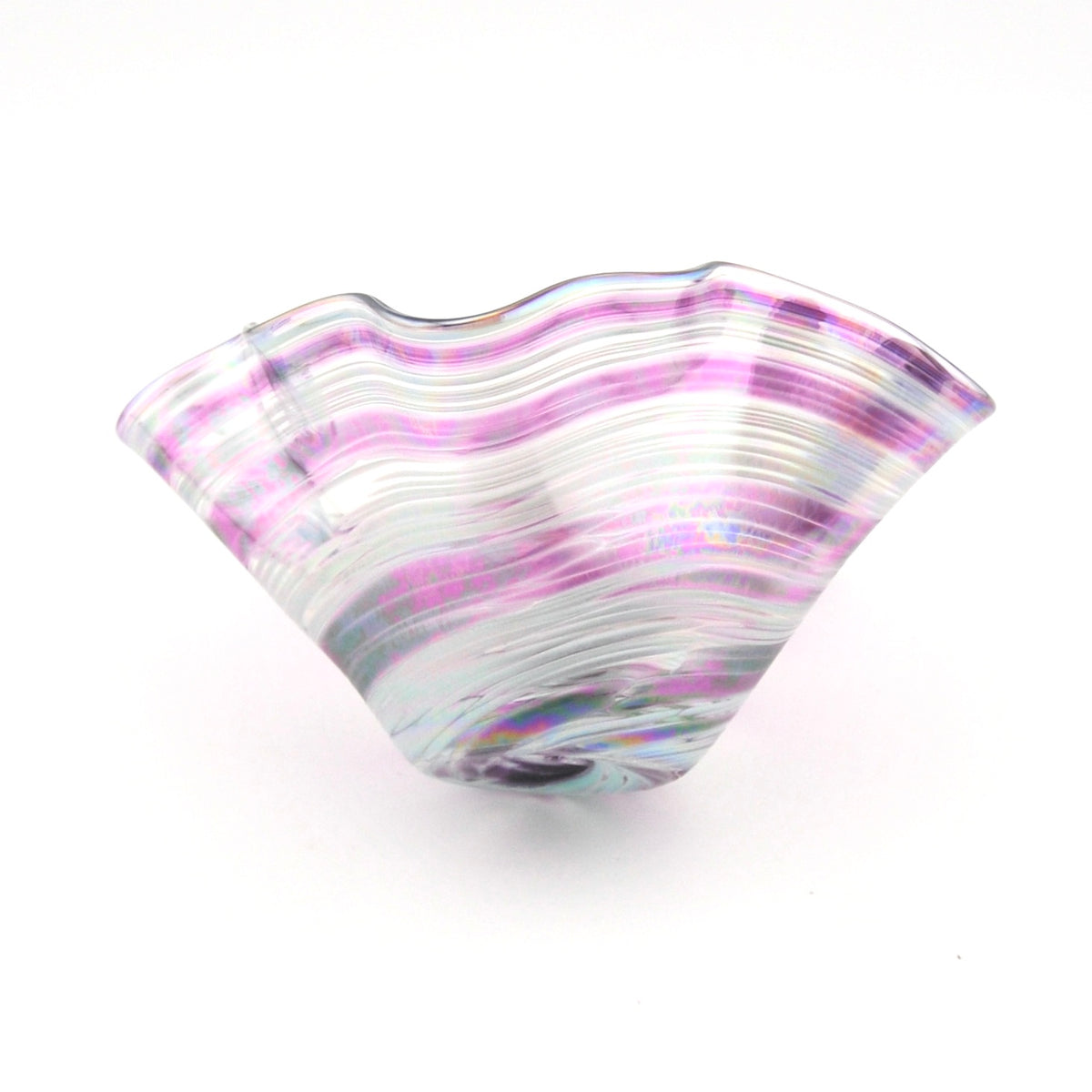 Glass bowl with wavy design and purple and white colors on a white background
