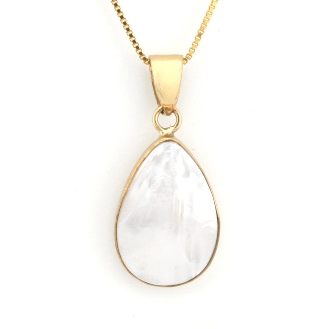 Gold necklace with a teardrop-shaped white pendant on a white background