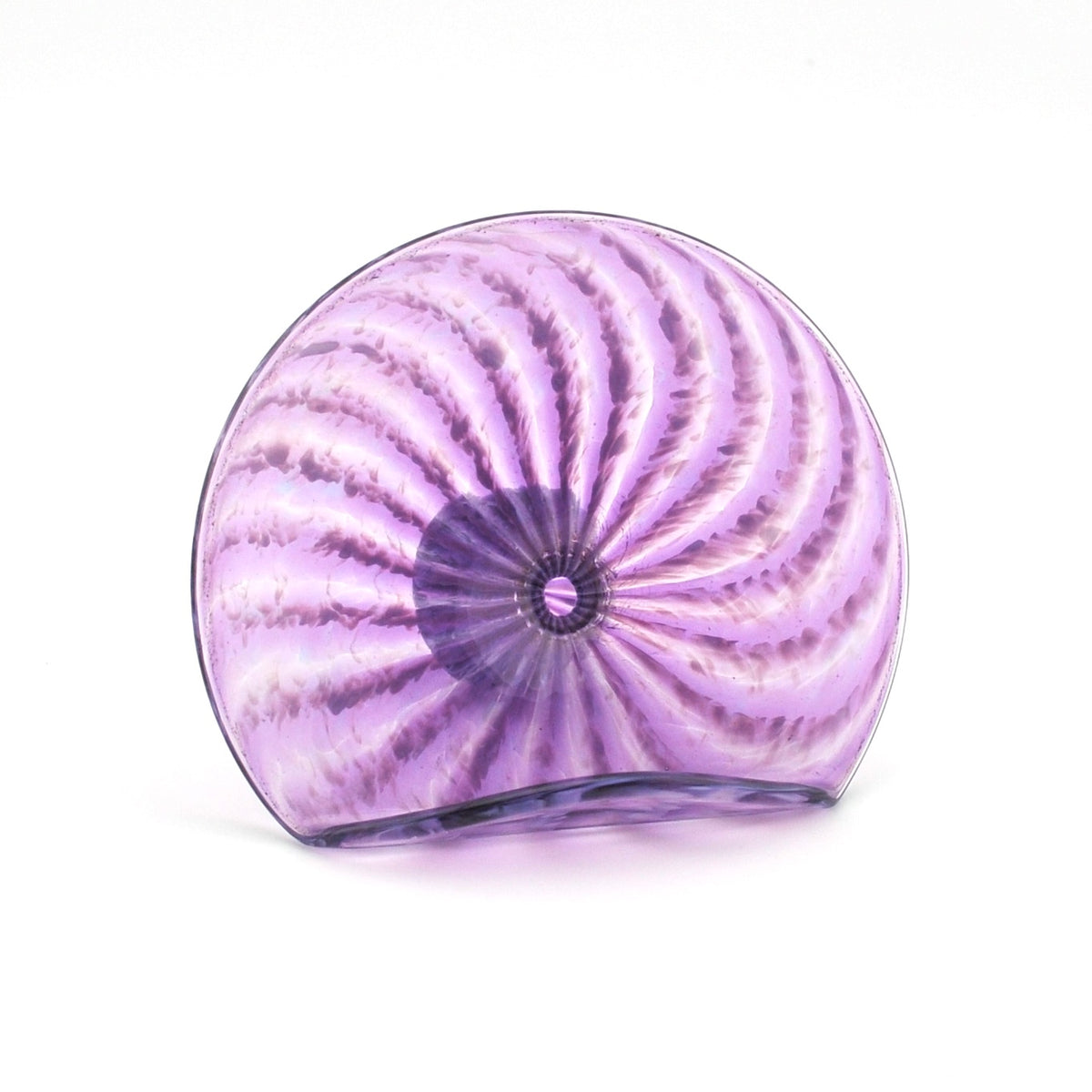 Purple glass sculpture with concentric swirl design on a white background