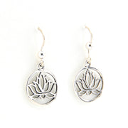 Silver lotus flower earrings on a white background