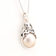 Pearl pendant necklace on a white background