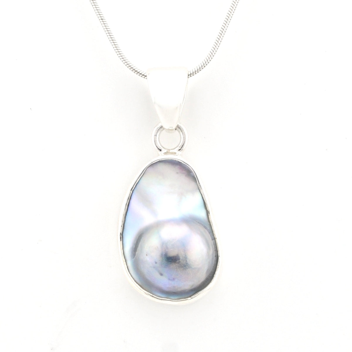 Pearl pendant on a chain against a white background