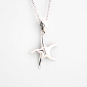 Silver starfish pendant on a chain against a white background