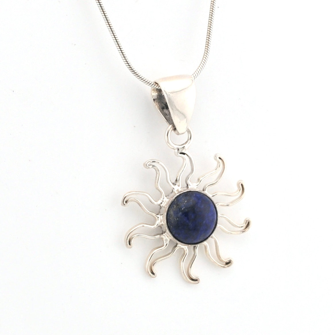 Silver sun-shaped pendant with a blue stone on a white background