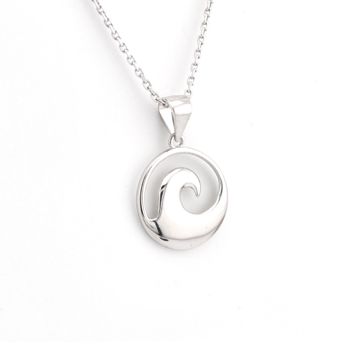 Silver wave pendant necklace on a white background