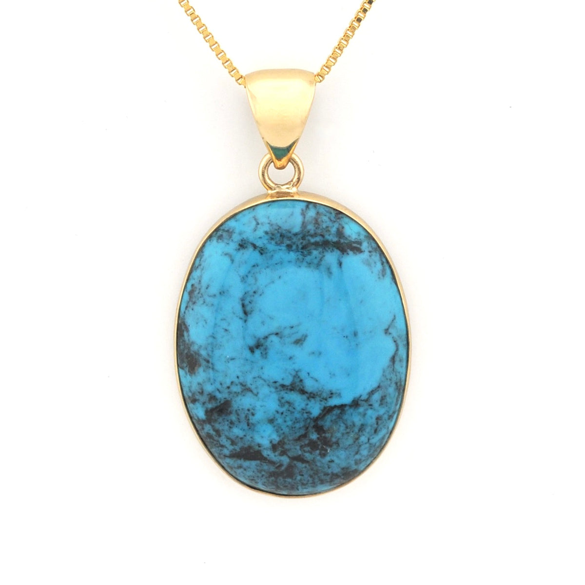 Gold necklace with a blue stone pendant on a white background