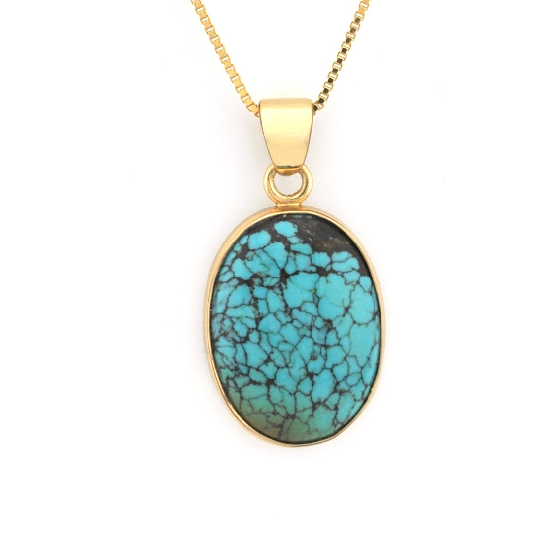 Turquoise pendant necklace on a gold chain against a white background