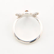 Silver ring with a small gemstone on a white background
