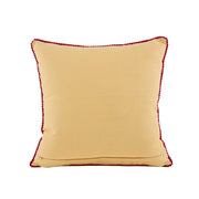 Beige pillow with red trim on a white background