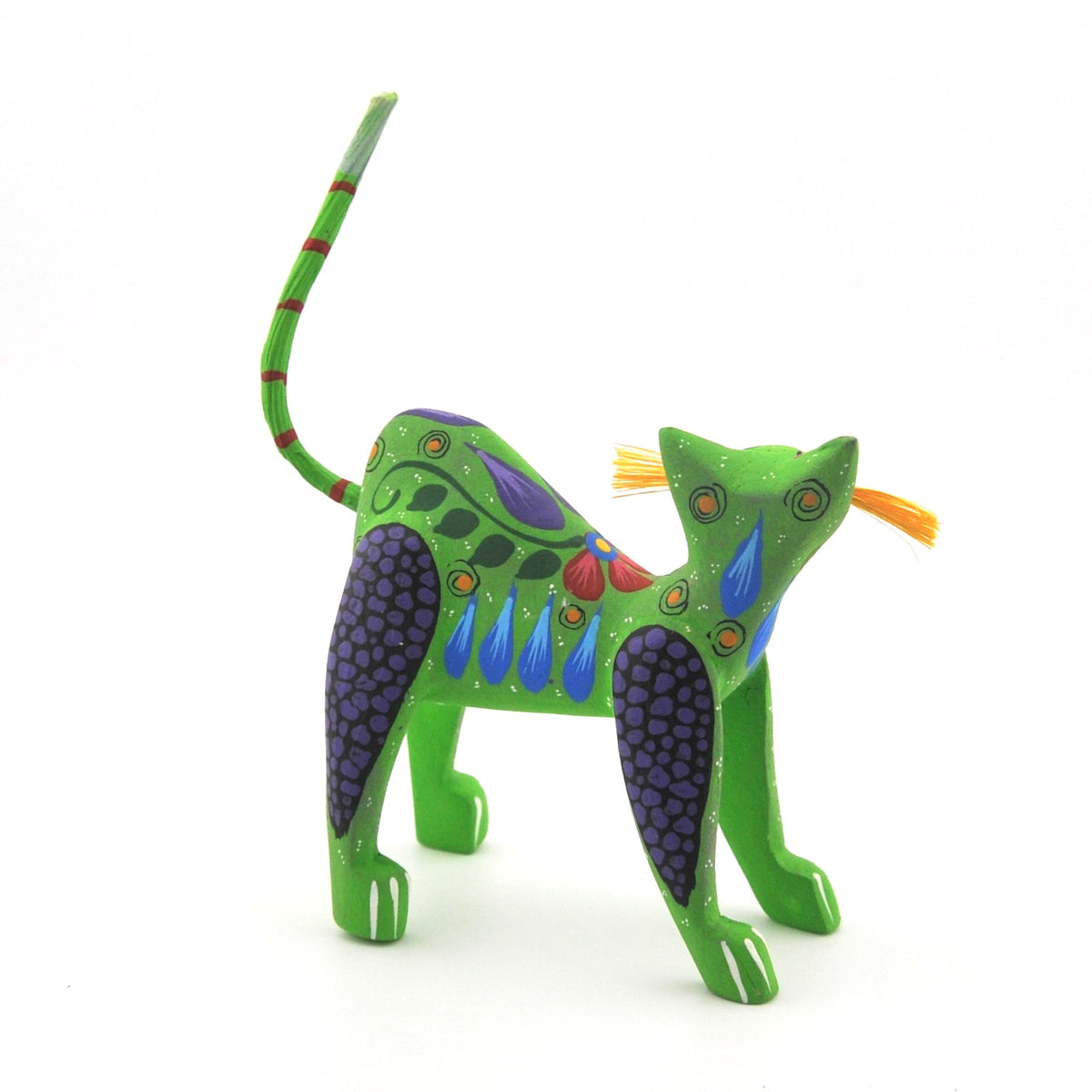 Colorful cat figurine on a white background