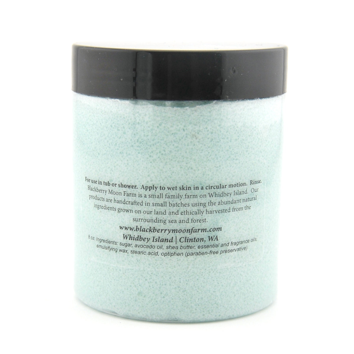 Jar of bath scrubwith a black lid on a white background