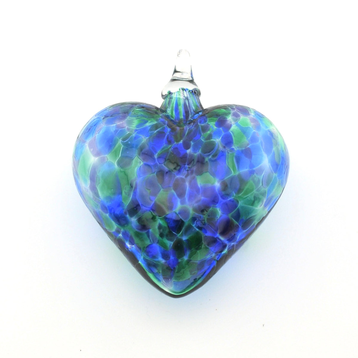 Glass heart ornament with blue and green pattern on a white background