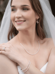 Model wearing blush pearl bracelet