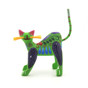 Colorful cat figurine with a long tail on a white background