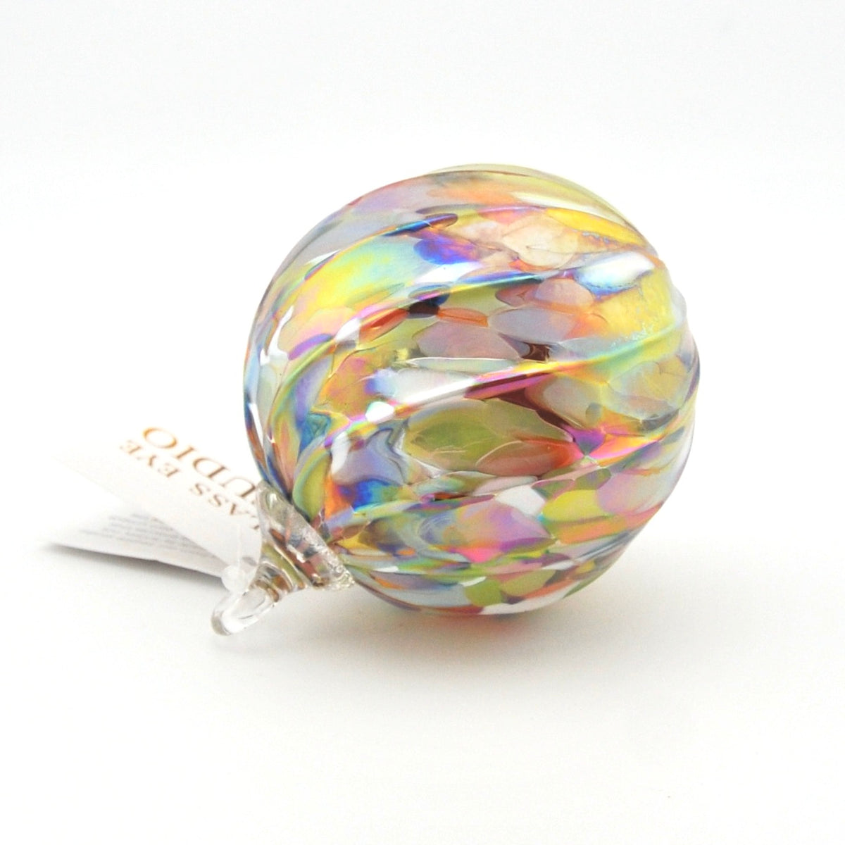 Multicolored glass ornament on a white background