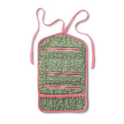 Floral patterned crossbody bag with pink accents on a white background