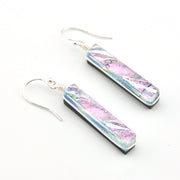 Pair of earrings with colorful bar design on a white background