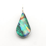 Teardrop-shaped pendant with multicolored iridescent surface on a white background