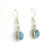 Side View Sterling Silver Blue Topaz 6x8mm Oval Dangle Earrings