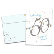 Greeting card with 'Celebrating 50 years of You!' text and decorative elements, accompanied by a matching envelope.