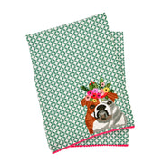 Tea towel with a bulldog design and floral headband on a green patterned background